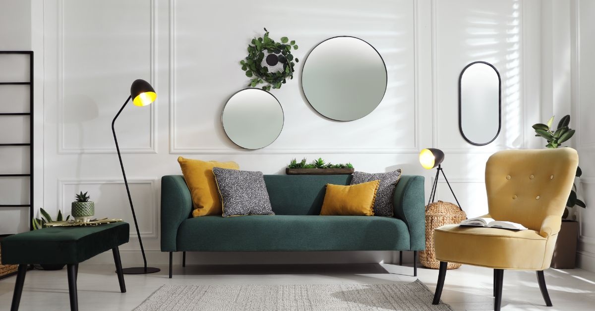 light yellow accent chair on the right and green loveseat in the middle of photo