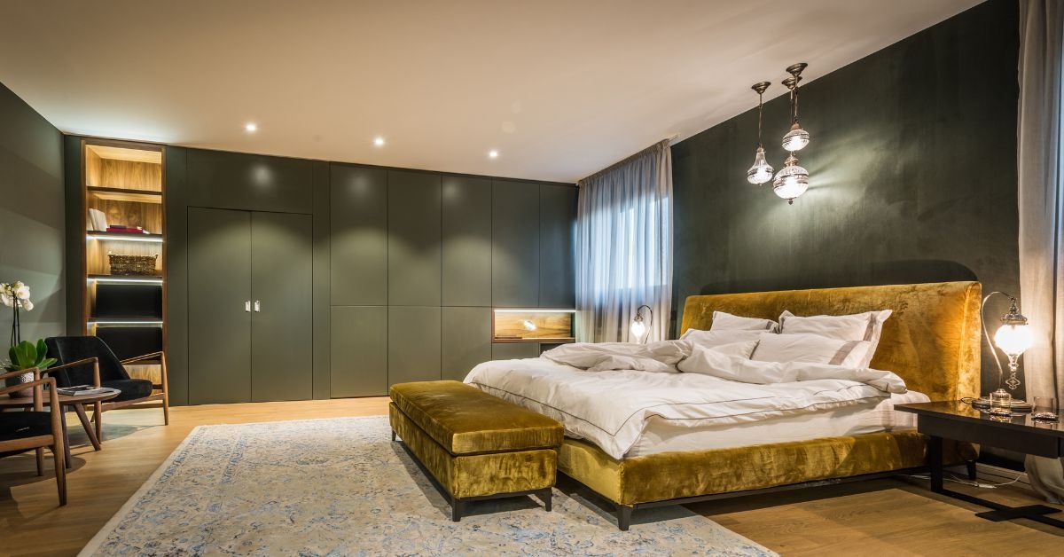 A wooden table with 4 brown chairs around and dishes on top of the table