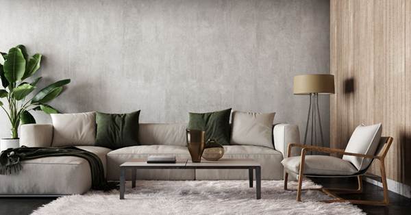 Two young ladies talking one holding a book another with box in a collge dorm