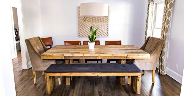 There is a white table with white chairs around